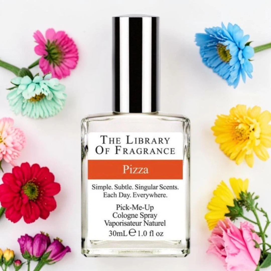 A bottle of 'The Library Of Fragrance' 'Pizza' cologne spray, surrounded by colorful artificial flowers on a white background. Demeter Fragrance Library Pizza | Fragrance Samples UK 1ml 2ml 5ml perfume samples available 