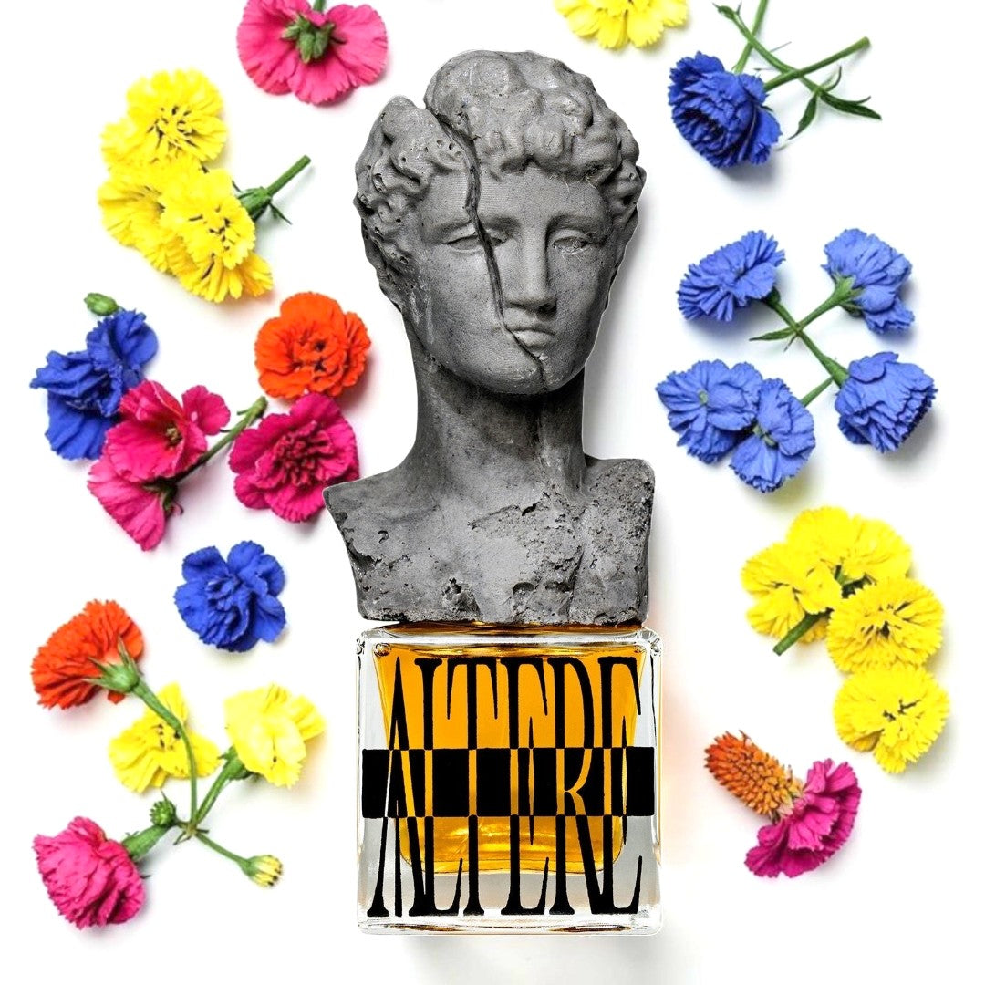 A perfume bottle labeled 'ALTERE' with a gray stone bust sculpture on top, surrounded by colorful flowers in yellow, pink, blue, and orange on a white background. Profundum Altere | Fragrance Sample UK 1ml 2ml and 5ml perfume samples available